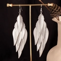 Detailed view of long silver leaf tassel earrings with multi-layered metal pendants - Leaf Earrings / Silver