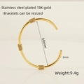 Adjustable 18K gold plated stainless steel open bangle with twisted wire details - Gold