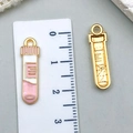 Pink and white enamel test tube pendants in gold finish with metric scale measurement - Pink Test Tube