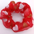 Detail of red mesh scrunchie with white and gold glitter heart prints for Christmas - Heart
