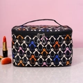 Portable makeup bag with colorful penguin prints on black background and dual zippers - Black Penguin