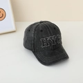 Macro shot of vintage washed cotton baseball cap with HYC letter embroidery details - Black with NYC Embroidery