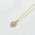 Elegant gold oval Virgin Mary pendant necklace with sparkling white zircon inlay - Oval Virgin Mary