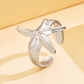 Polished silver starfish open ring in ocean theme style shown from a 45-degree angle - J03433 / Silver