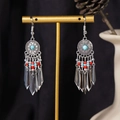 Detail of Bohemian droplet tassel earrings with blue stones on a display stand - S4295-3 Mixed Color Seed Bead Tassel Earrings