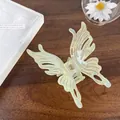 Iridescent light green butterfly hair claw clip with cutout wings on wooden background - Large Butterfly 9cm / Iridescent Green