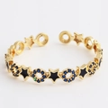 Gold star and circle open ring with blue zircon pave and black enamel finish - Star Black