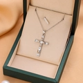Elegant silver cross necklace with micro-inlaid zircons displayed in a luxury gift box - 9213 / Silver
