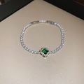 Detailed macro of a silver clover tennis bracelet with green emerald zircon centerpiece - 8# Silver Green Clover Style