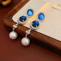 Orecchini eleganti con zaffiri blu e perle bianche per uno stile raffinato - Orecchini (HE15990) / Argento