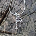 Vintage silver frog pendant necklace with snake chain on rustic wooden background - Silver Necklace