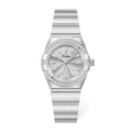 Close-up of a silver ladies watch featuring a diamond bezel and sunburst dial detail - Grey Dial Steel Strap