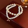 Gold plated pearl bracelet with fishtail charm and moonstone accents in luxury style - Gold Fish Tail