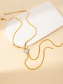 Detail of gold heart pendant with white zircons on a sleek flat herringbone chain - Zirconia Heart Pendant Necklace