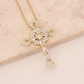 Detailed view of golden cross necklace with marquise and round white crystals on stone - White Zirconia