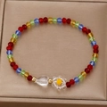 Colorful beaded bracelet with heart charm and floral accents on a luxury gold display - Rainbow Faceted Bead Heart Flower Bracelet (6348)