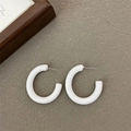 Minimalist matte white acrylic C-shaped earrings with silver needles on textured background - Silver Earring Post-White / White