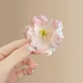 Pink and white gradient mesh flower hair clip with realistic yellow stamen detail - Pink Cherry Blossom