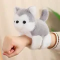 Plush husky snap bracelet toy made of soft grey and white faux fur on a wrist - Husky