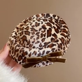Detailed view of leopard print hair clip with brown velvet bow and soft fabric texture - Coffee Leopard Duckbill Clip