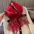 Detail of red faux silk scarf with gold lurex stripes and elegant pearl bead trimmings - Red