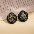Close-up of vintage oval resin earrings with portrait relief on retro newspaper - Silver Earring Post-Black
