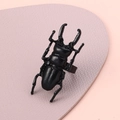 Unique black beetle ring with detailed insect anatomy on soft purple leather base - Stag Beetle Ring (A-891) / Bright Black