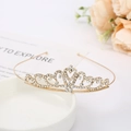 Close-up of golden bridal crown with sparkling rhinestones on an elegant ceramic tray - Crown Style 10