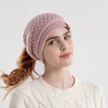 Women's pink knit beanie featuring a convenient ponytail hole design and leather label - Pink