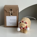 Polar bear candle in cream white wearing a red scarf, with retro kraft gift box packaging - Light Brown Polar Bear with Scarf