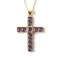 Detailed view of copper cross necklace with purple zircon stones and golden finish - Purple