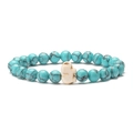 Close-up of blue turquoise beads and a white elephant charm on an elastic bracelet - Green Veined Turquoise