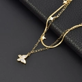Double-layer gold stainless steel necklace with butterfly and star pendants on snake chain - Gold