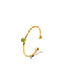 Macro detail of gold open ring featuring a single green zircon stone and spherical ends - Light Green