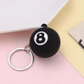 Black No. 8 pool ball keychain with silver ring on colorful soft background - No.8/Black
