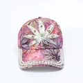 Detailed view of pink floral baseball cap featuring rhinestone and pearl leaf embellishments - Adjustable / Purple Leaf