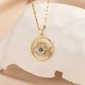 Detailed macro view of gold evil eye pendant with blue crystals on stone base - Gold White Zircon