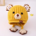 Detail of yellow knitted bear ear hat for kids with thick texture and cute paw tassels - 3-8 Years / Yellow