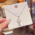 Silver celestial moon and star pendant necklace with clear crystals on display card - X358 Silver Star Moon Zirconia