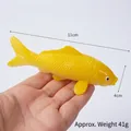 Realistic 11cm yellow koi fish PVC keychain model shown held in hand for scale - 11cm / Model Style / Yellow