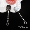 Close-up of 7x30mm miniature silver alloy spoons for dollhouse accessories and DIY crafts - Medium Shovel (7x30mm)
