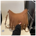 Detailed close-up of brown vintage crossbody bag featuring long stylish fringe and gold hardware - Brown
