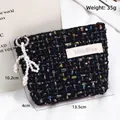 Elegant black tweed cosmetic pouch with sequins and pearl bow charm, size 13.5x10x4cm - Elegant Tweed Style / Black