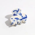 Elegant off-white hair claw clip with blue marble ink pattern and glossy finish - Blue & White