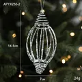 Silver hollow spiral Christmas ornament with glitter finish on a warm tree branch - Silver Large Spiral Teardrop