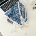 Close-up of blue floral cotton kerchief with white lace edge detail and styling props - Small Floral Dark Blue Base
