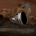 Vintage silver men's ring with large black onyx gemstone and intricate vine engravings - Black Oval Stone
