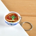 Miniature blue and white porcelain bowl keychain featuring realistic beef noodle soup detail - Pork Rib Noodles