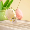 Golden Christmas necklace with Santa pendant featuring colorful gemstone inlay details - Santa Claus White / Gold