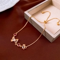 Detail of gold zircon butterfly bracelet on jewelry box with adjustable chain closure - Zirconia Butterfly Style / Gold